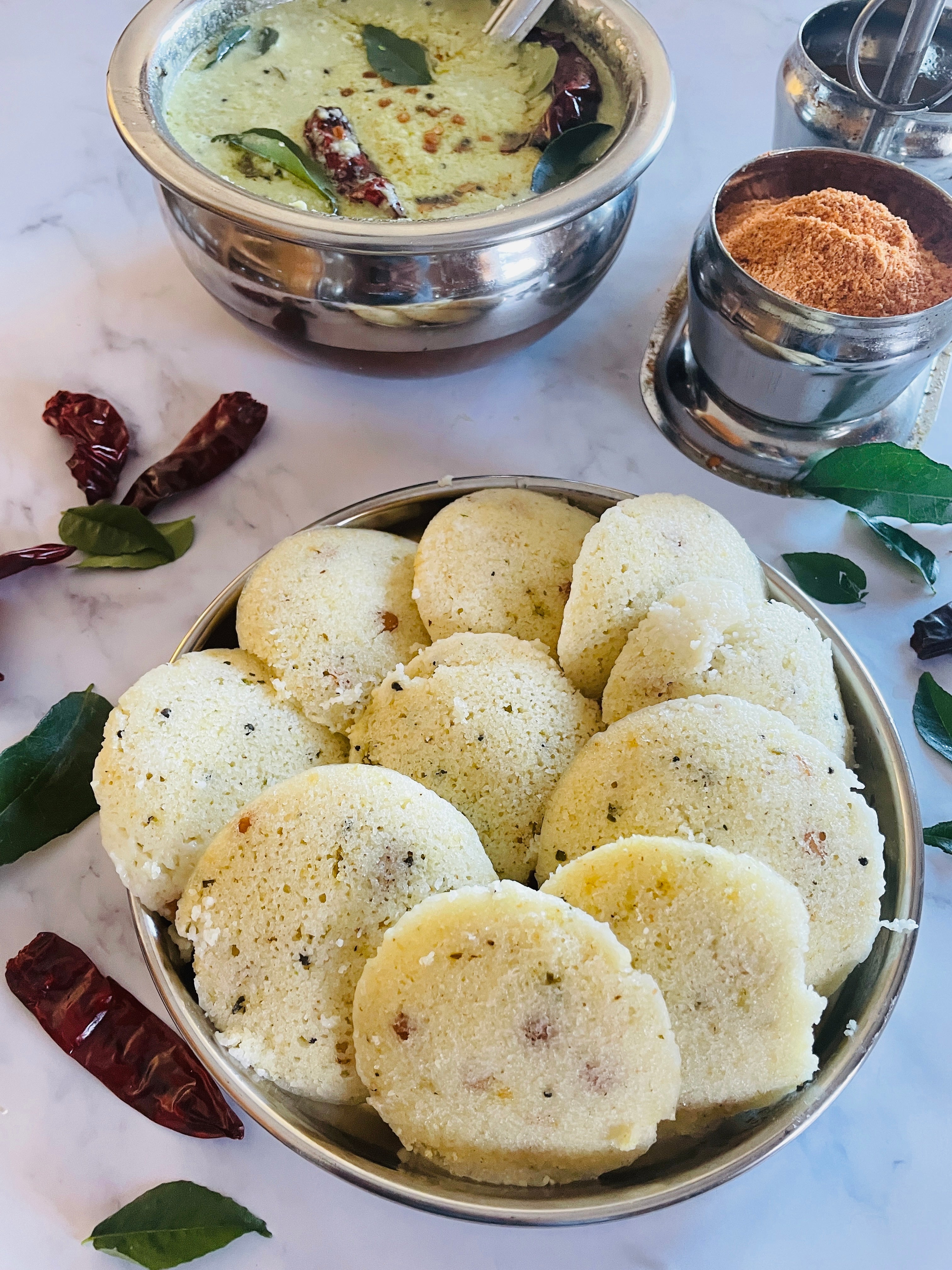 Oats Idli presented with traditional coconut sauce
